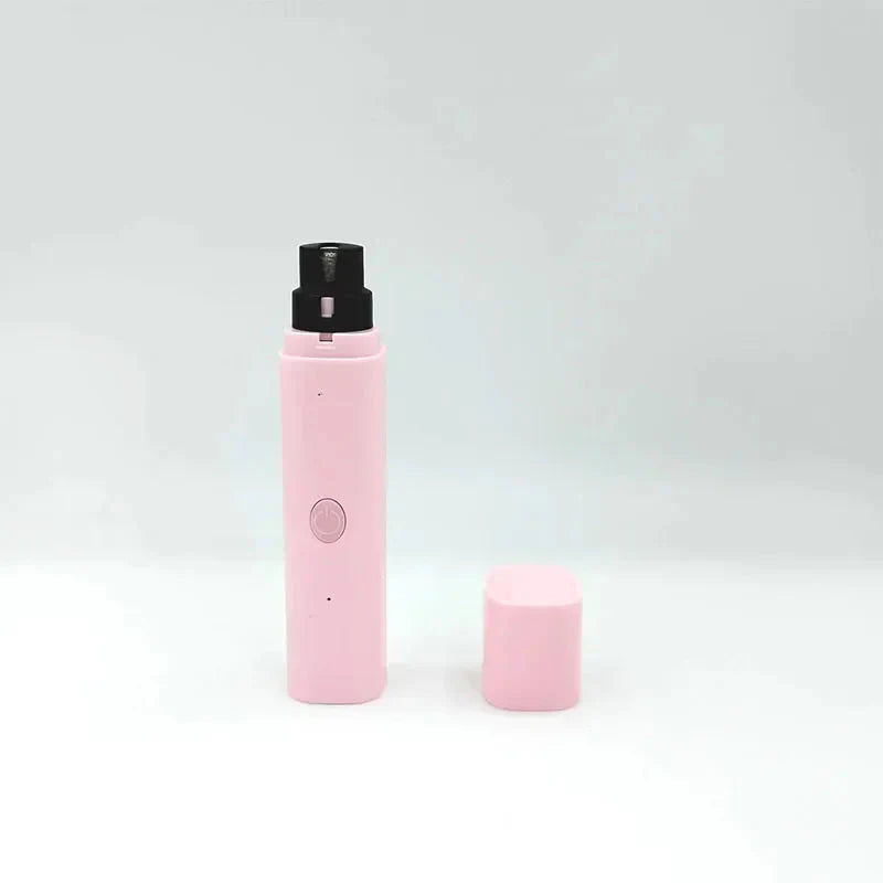 Pink electric pet nail grinder with black top and spare grinding cap