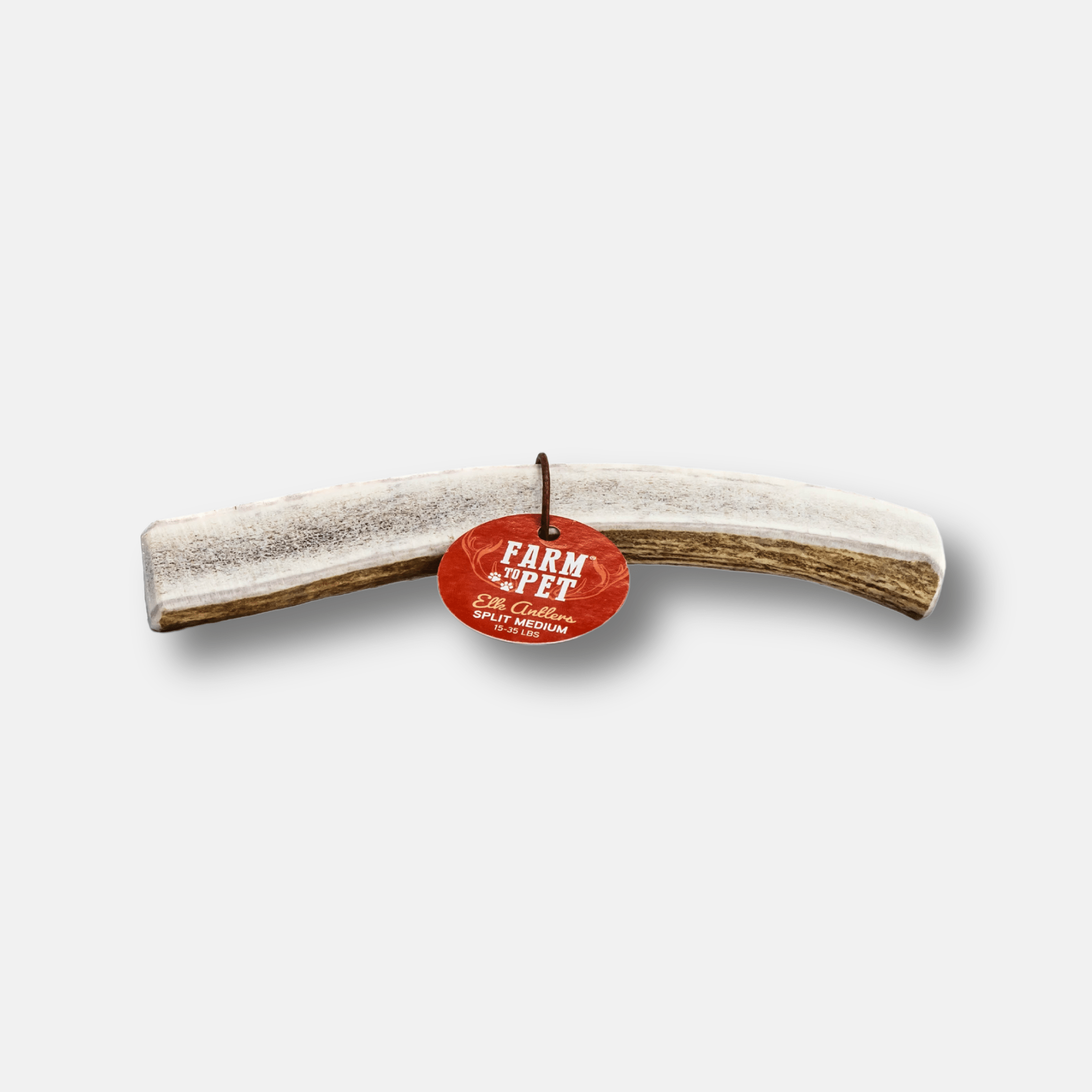 Curved elk antler dog chew with red Farm Pet tag
