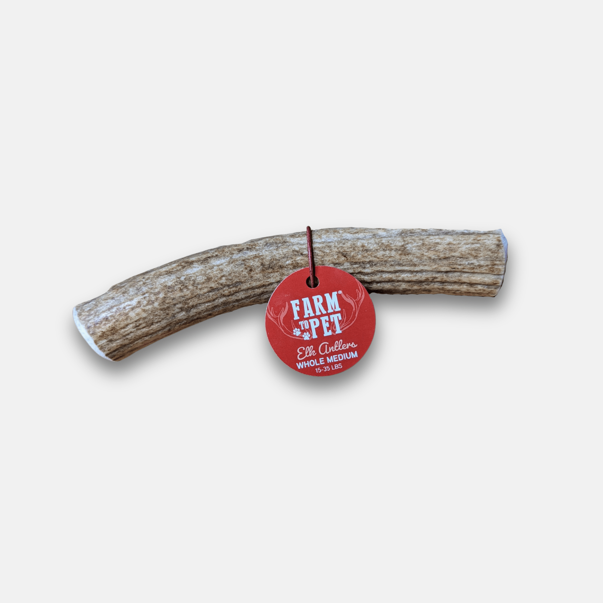 Elk antler dog chew log with red Farm to Pet tag, whole medium size