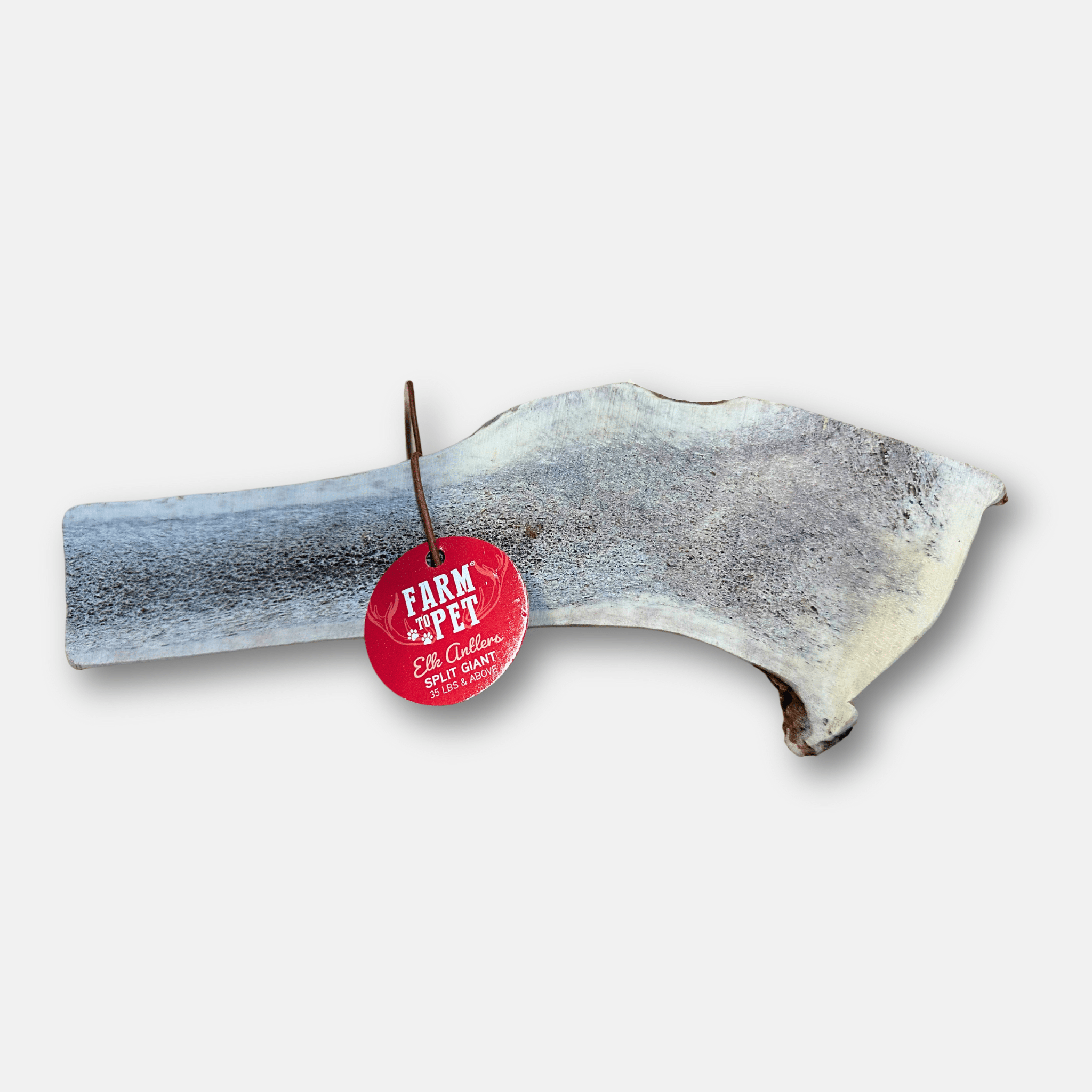 Split elk antler chew with red Farm to Pet tag on a plain white background
