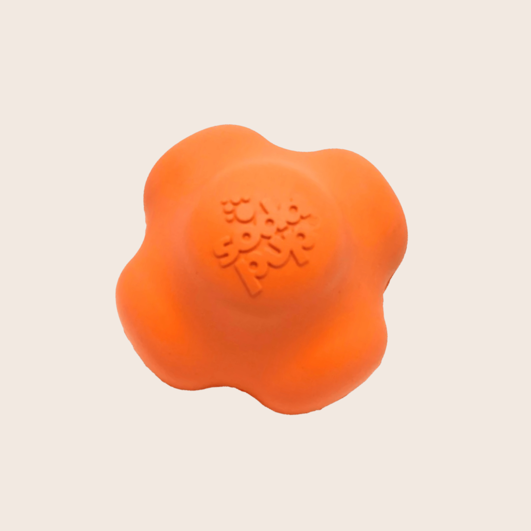 Orange rubber dog fetch ball with paw-textured grip