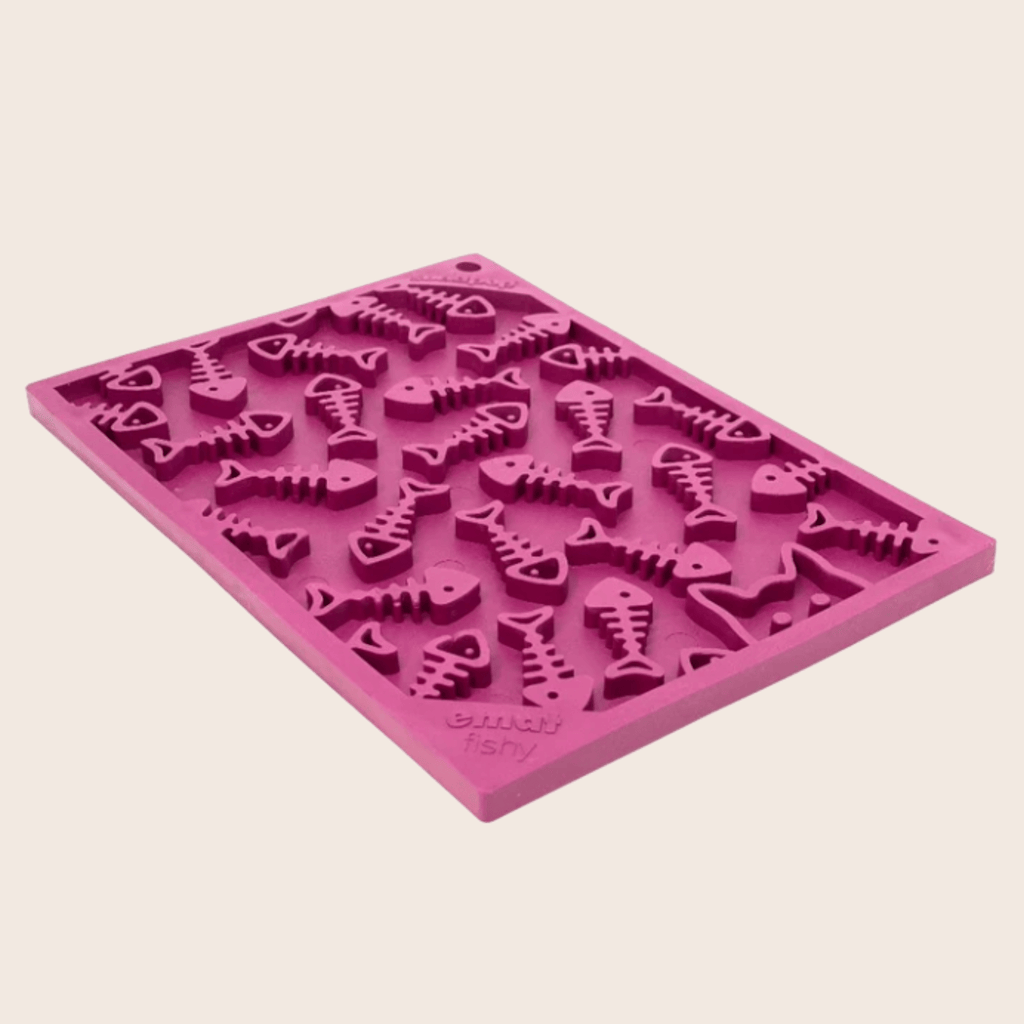 Pink flower power lick mat for cats and small dogs with raised fish-shaped ridges