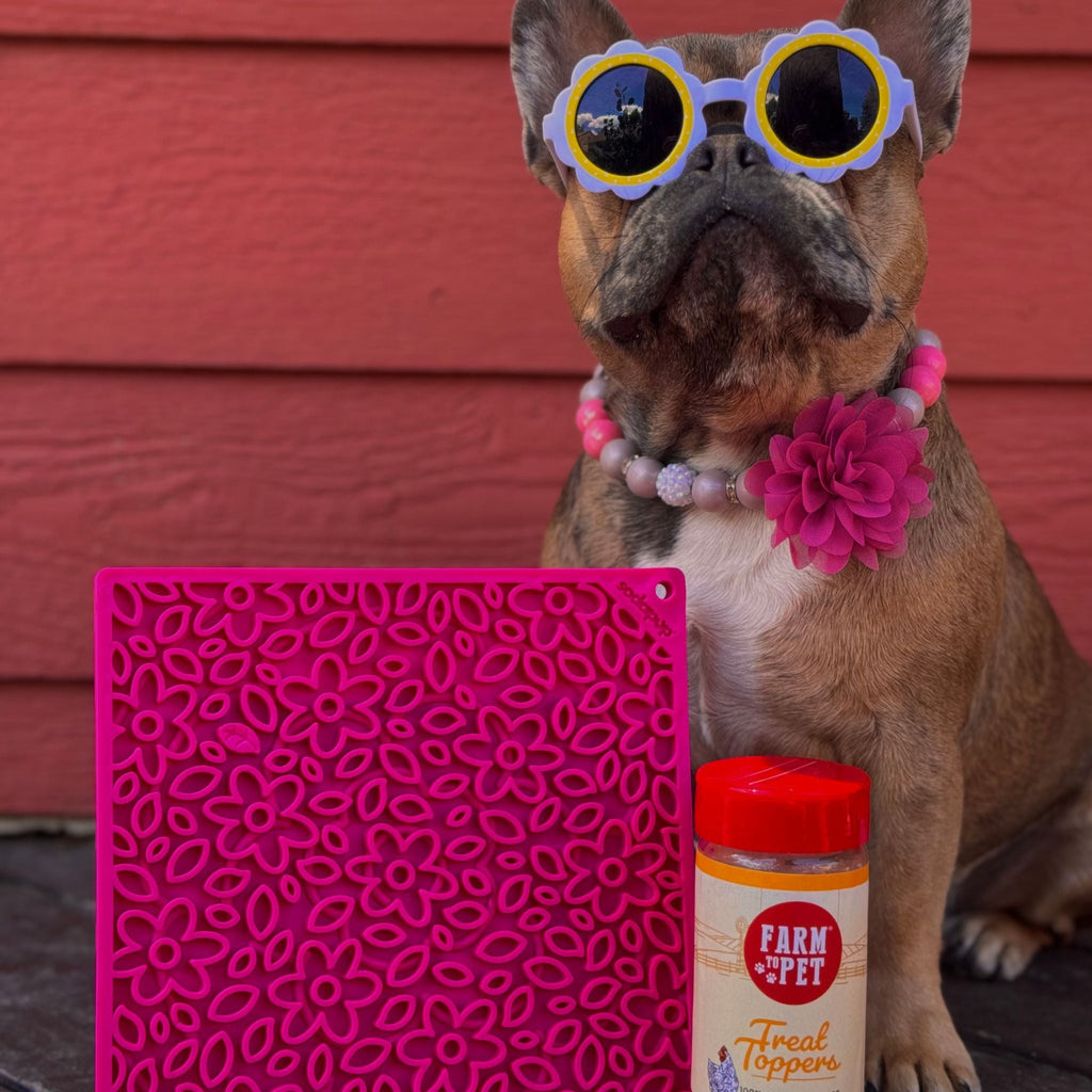 Pink flower-pattern dog lick mat with raised grooves, square silicone tray.