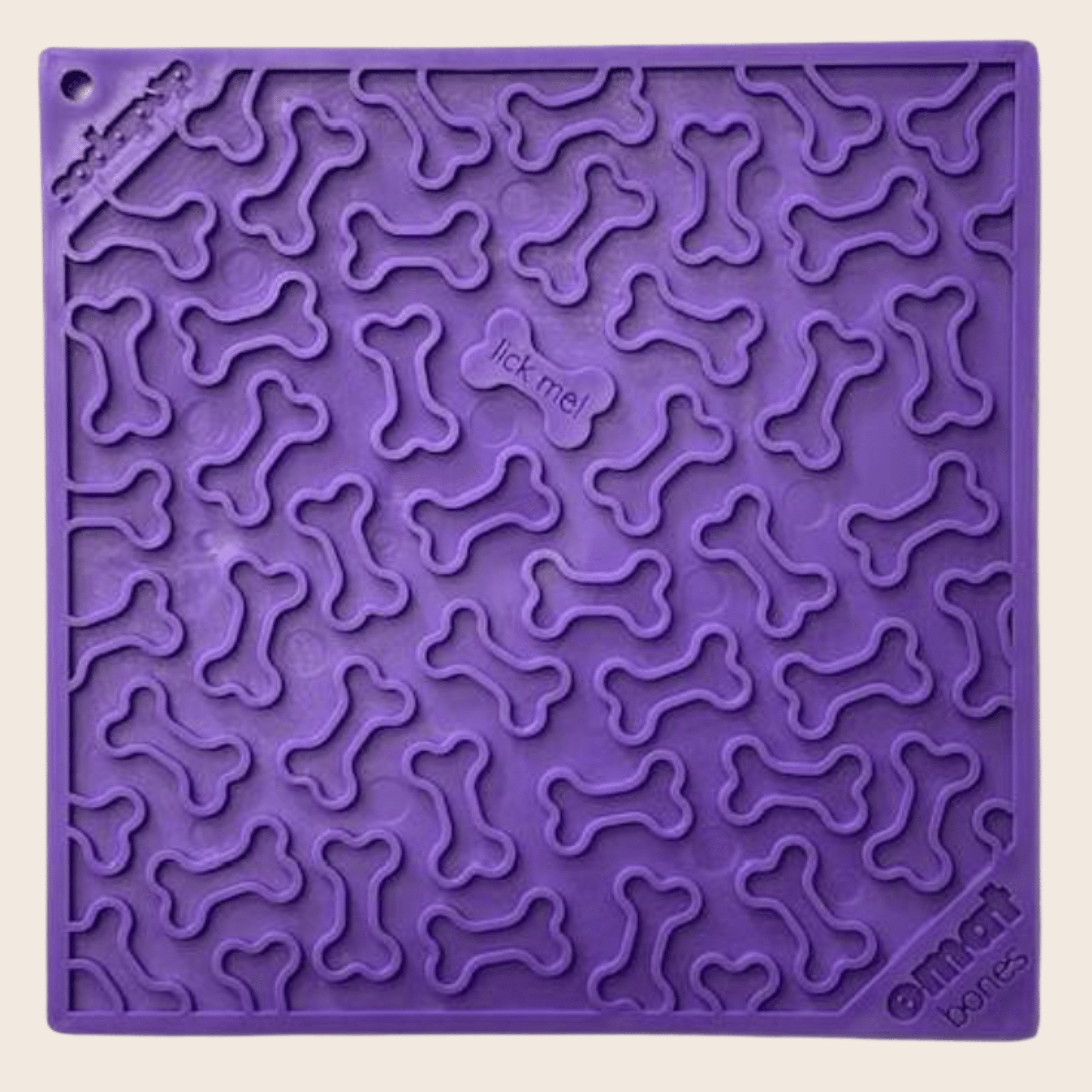 Purple dog bone pattern dog lick mat with raised grooves, square silicone tray.