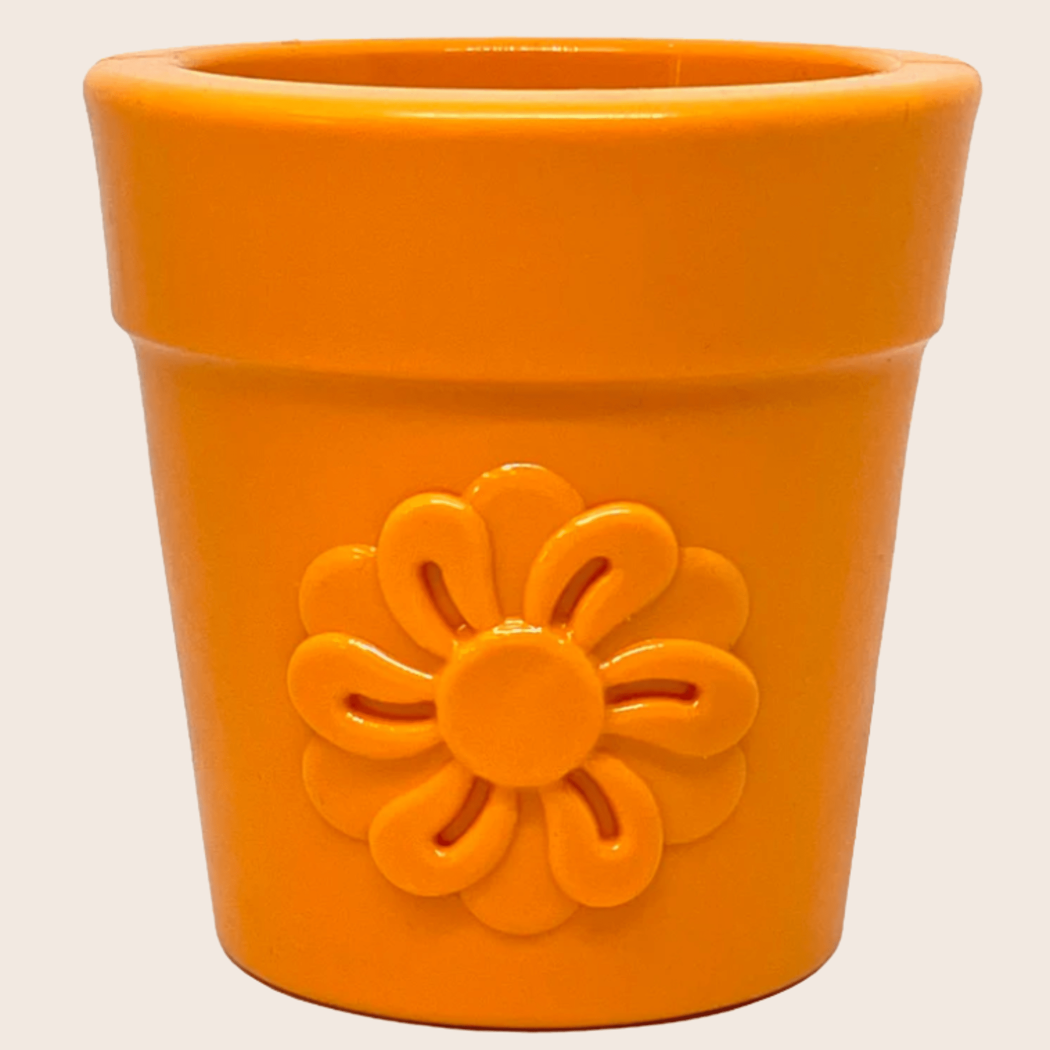 Orange flower pot dog treat dispenser with embossed flower on the front.