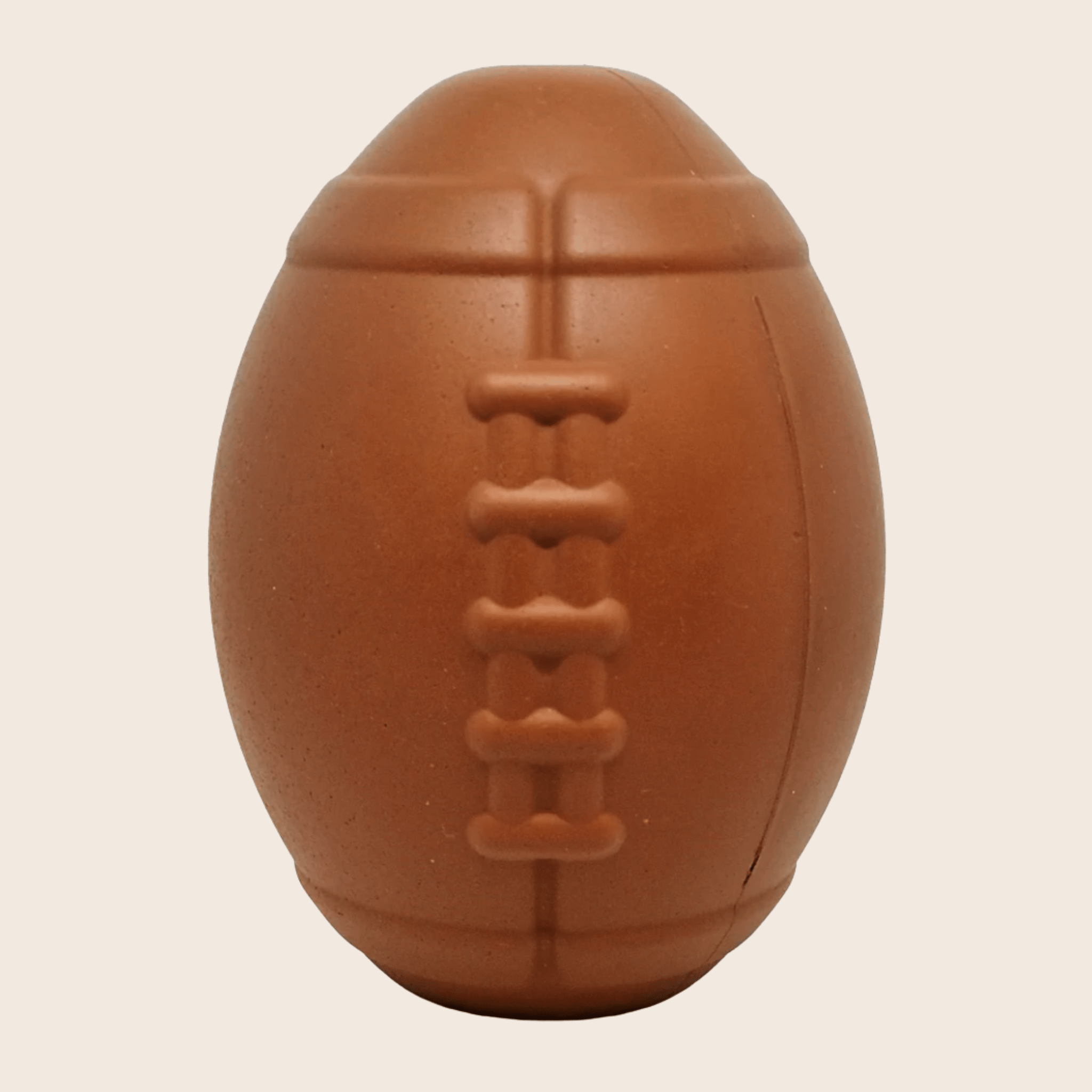 brown football-shaped dog treat dispenser with embossed chew line detail