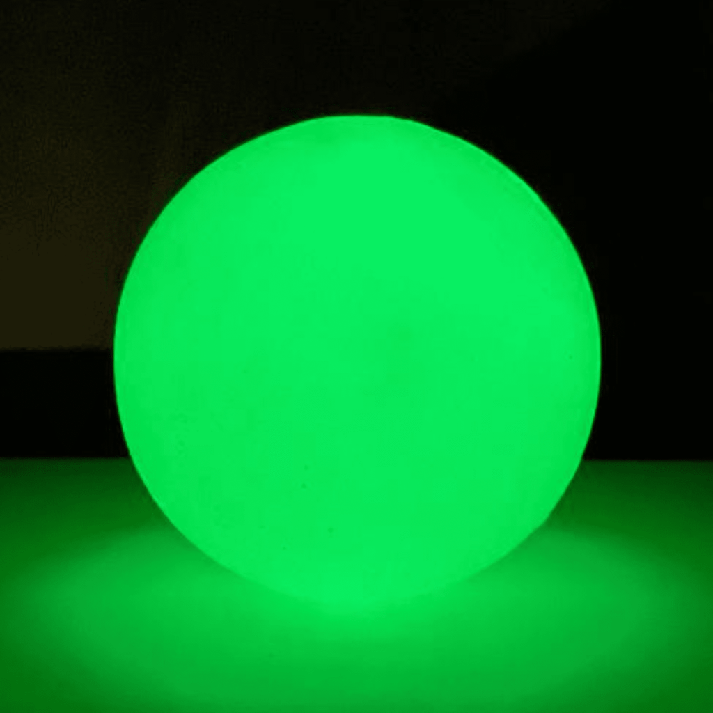 Glow-in-the-dark dog treat dispenser ball, bright neon green