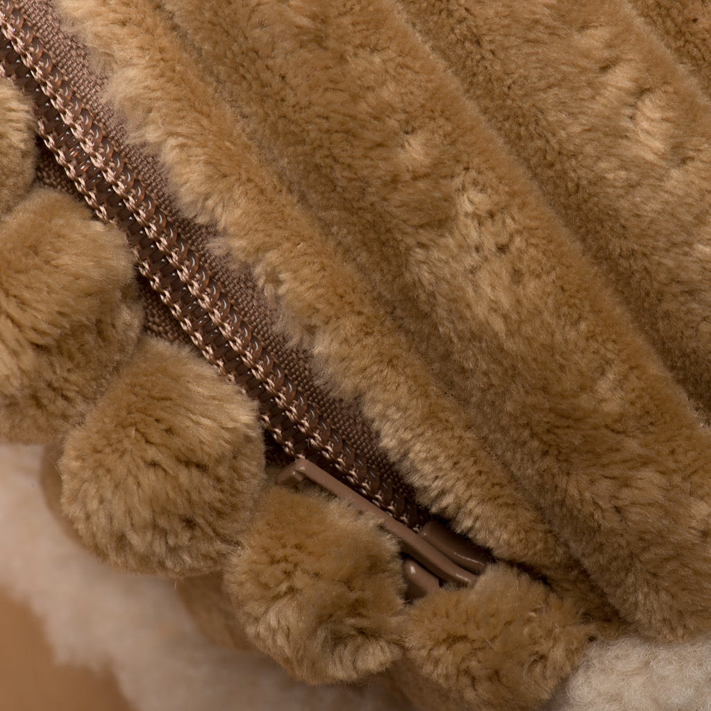 Khaki plush dog bed close-up showing zipper and furry fabric texture