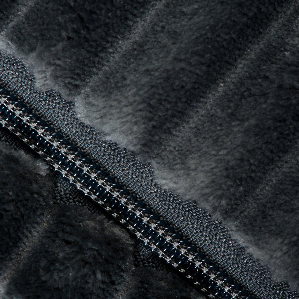 Steel blue plush dog bed close-up showing zipper and dark fabric texture