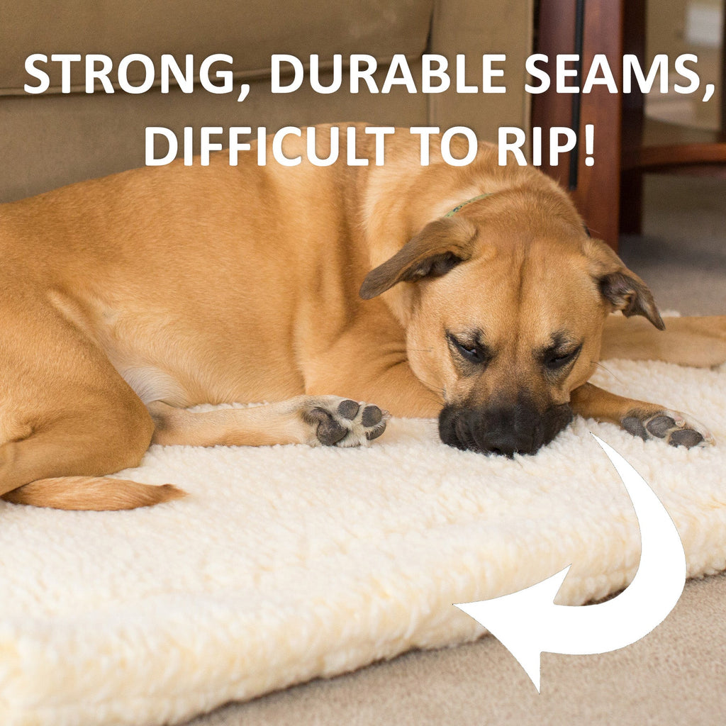 White fleece pet mat with tan dog sleeping on the plush bed surface