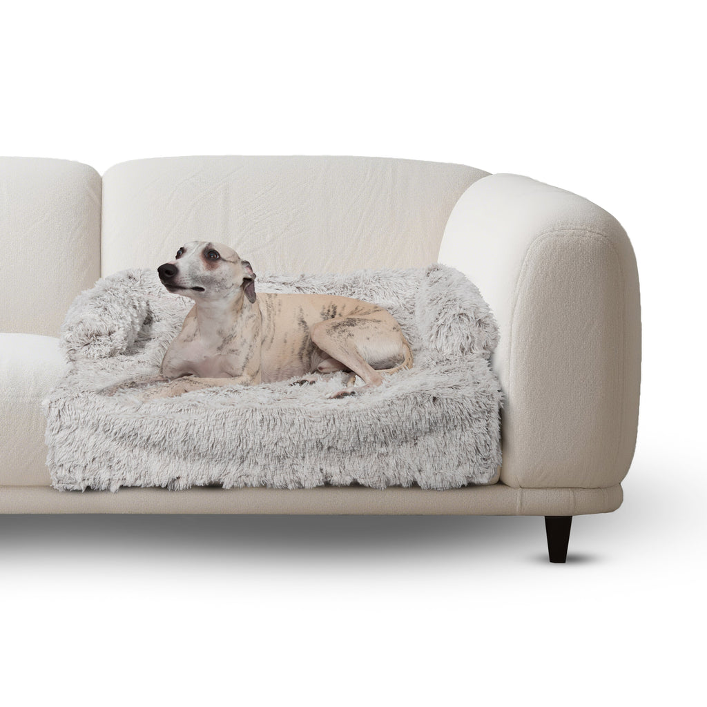 Calming sofa protector bed with plush light faux-fur cover and raised side walls