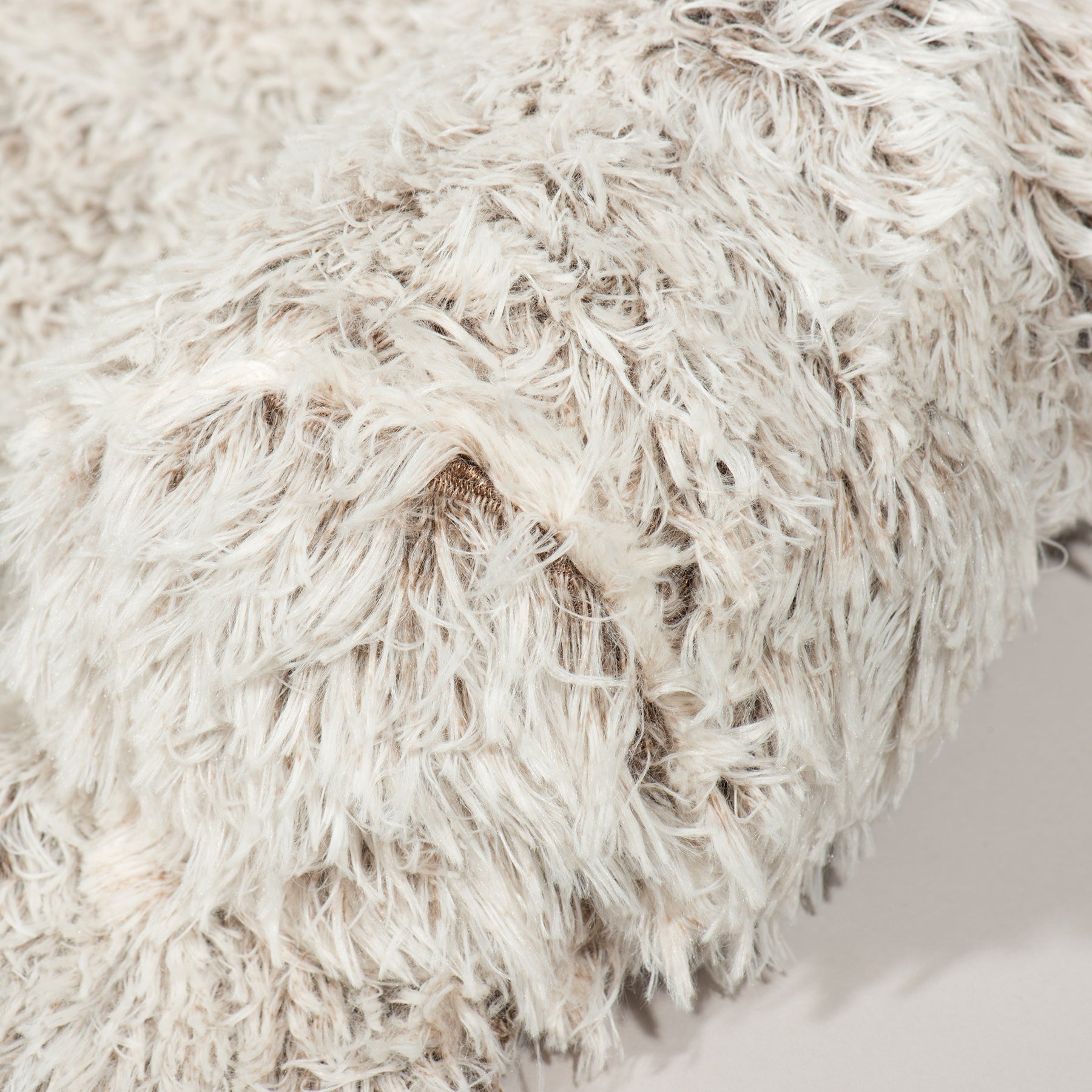 Shaggy cream faux-fur cover with dense curly texture