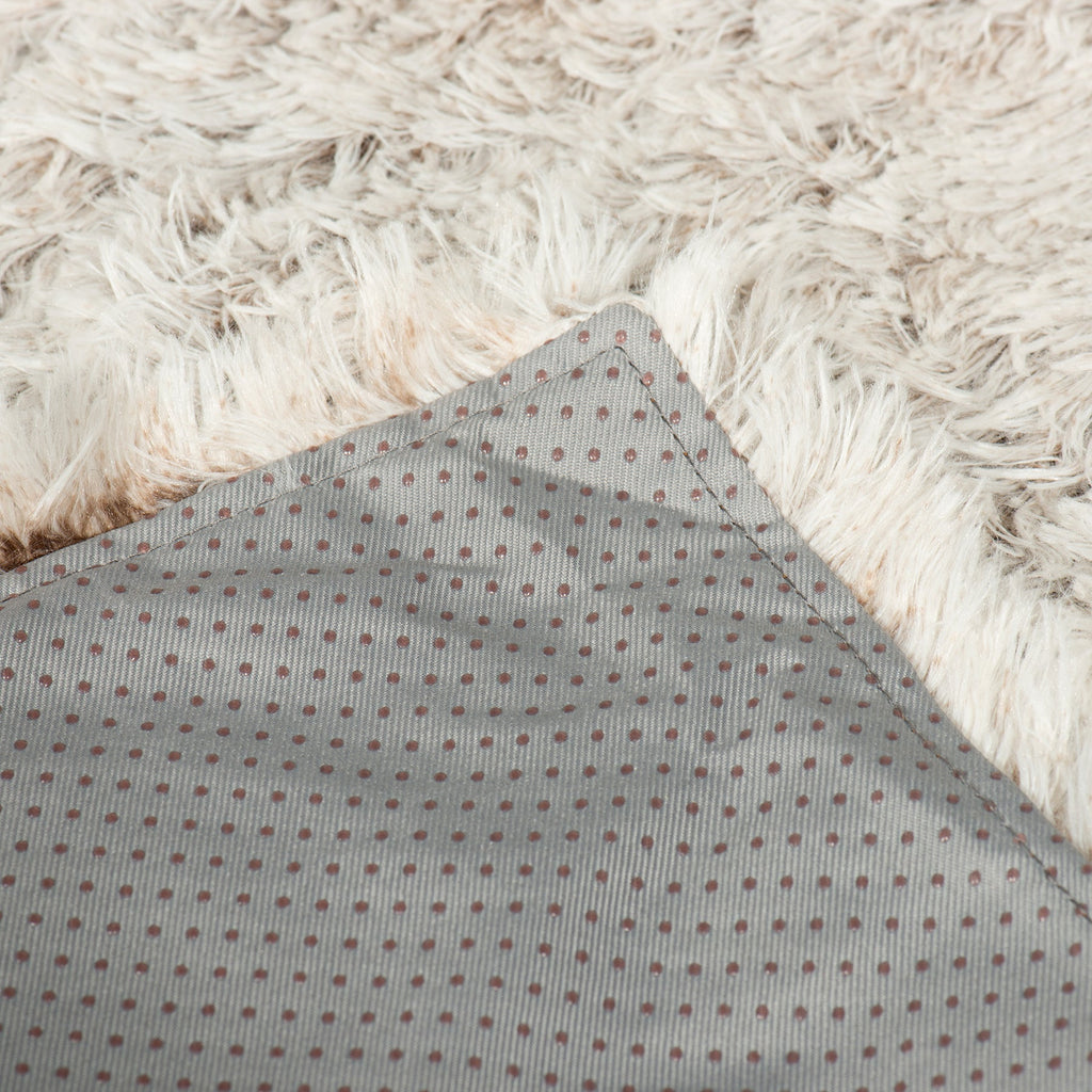 Zippered inner panel with gray dotted fabric under cream faux-fur edge