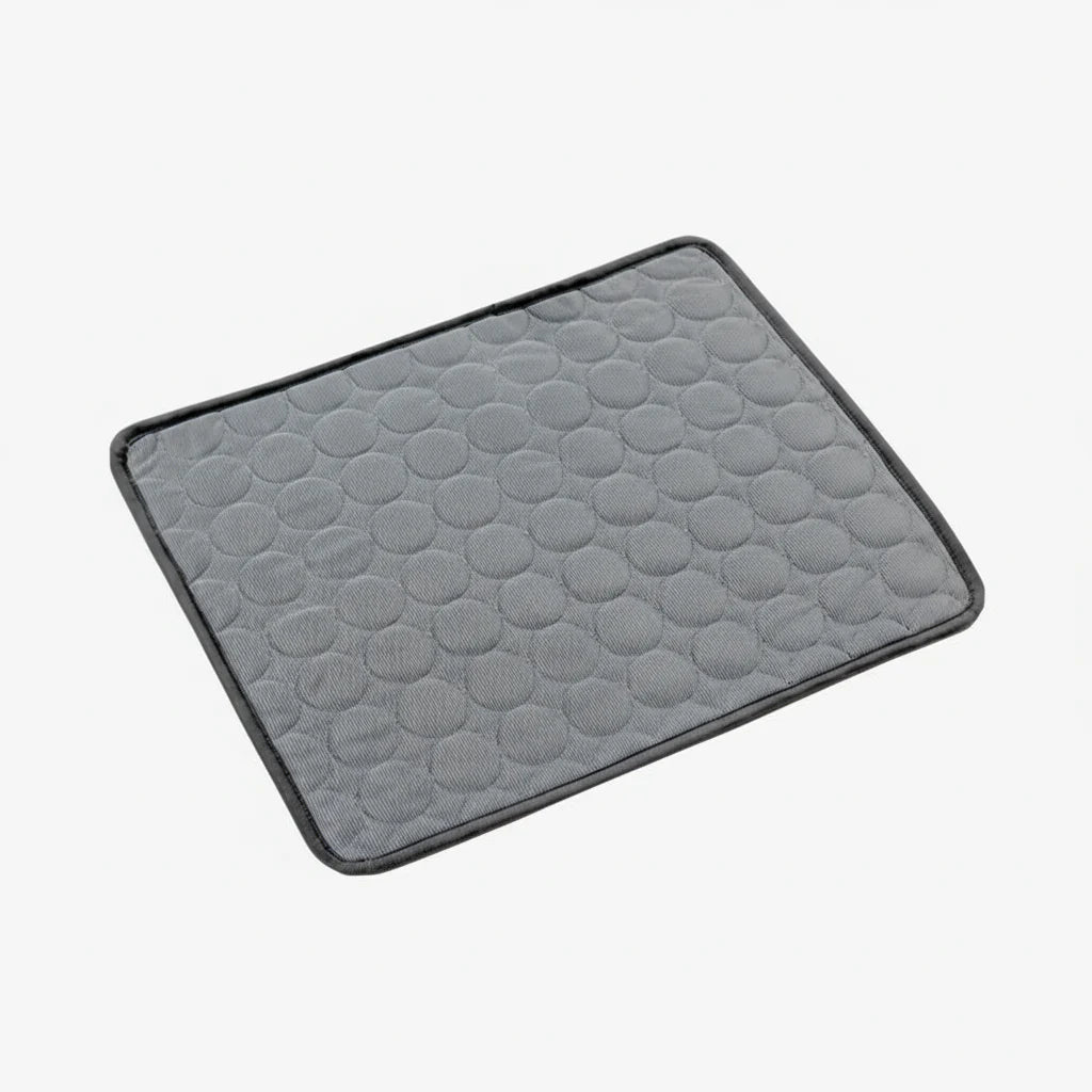Dark gray cooling dog mat with hex-textured surface and black stitched border