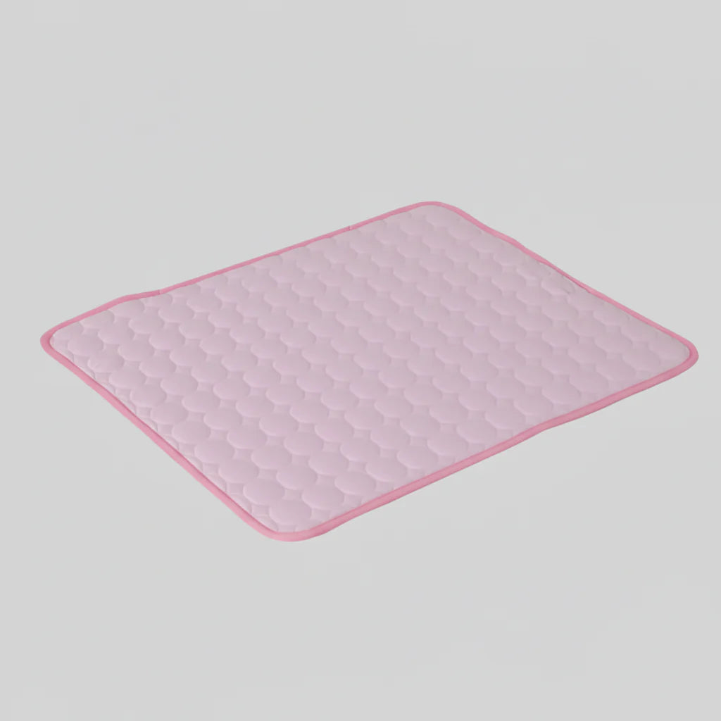 Pink cooling dog mat with raised hex-textured surface and pink stitched border