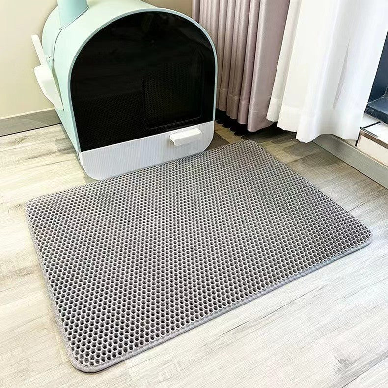 Double-layer EVA cat litter pad, light gray hex-pattern surface with white edging.