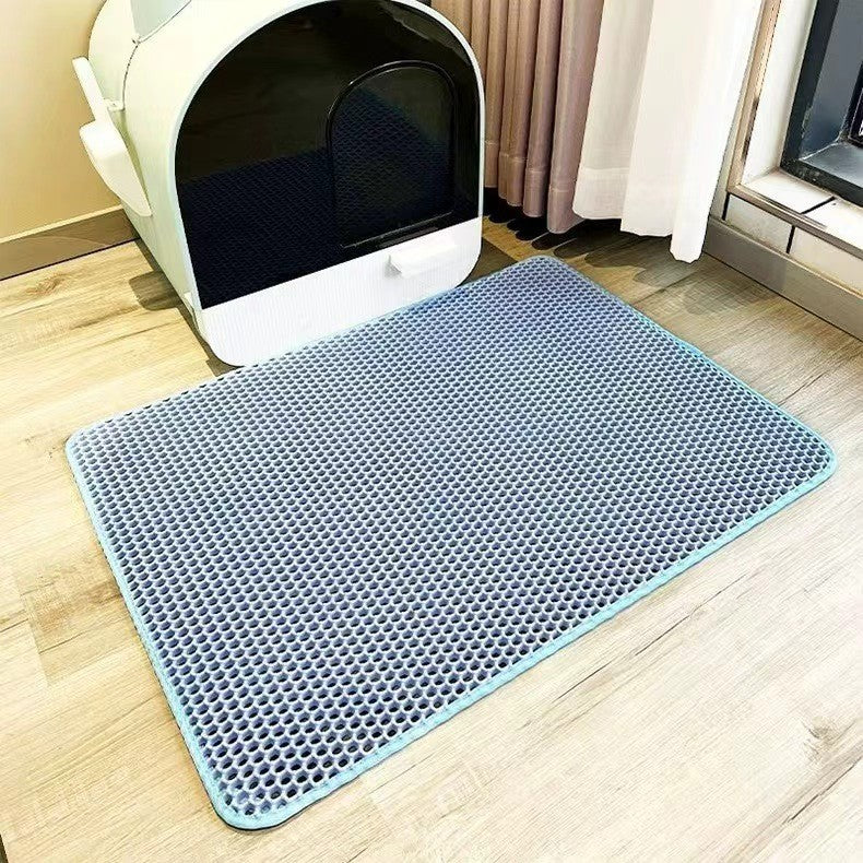 Double-layer EVA cat litter pad, light blue hex-pattern surface with rounded corners.