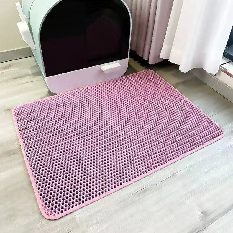 Double-layer EVA cat litter pad, pink hex-pattern surface with rounded corners.