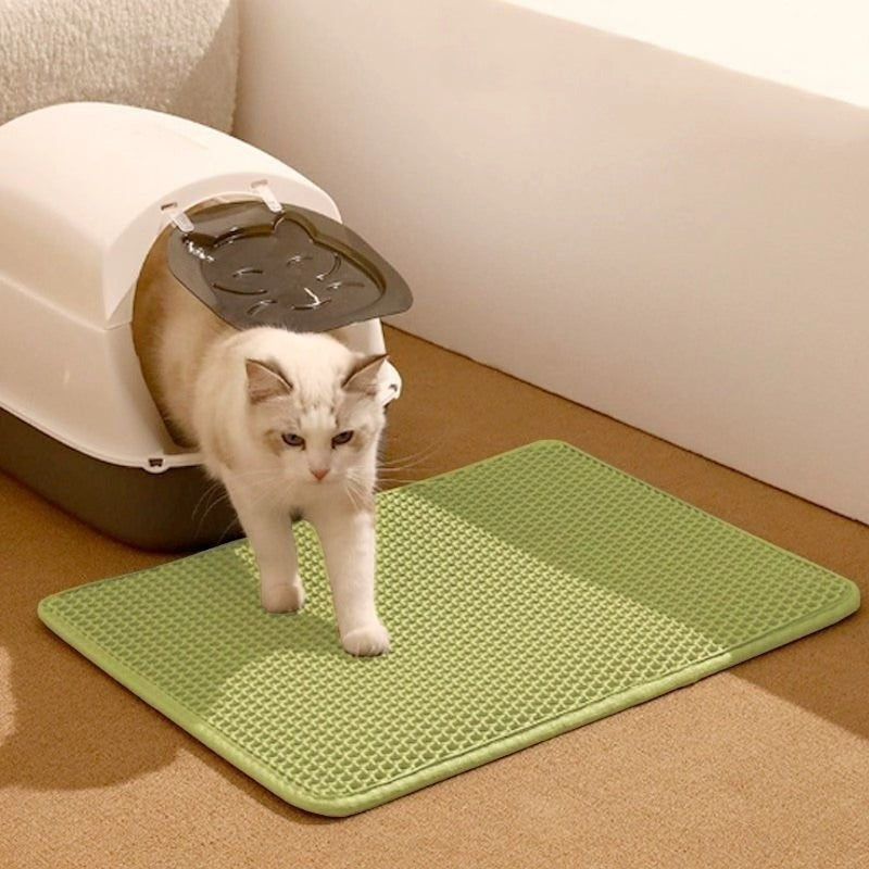 Double-layer EVA cat litter pad, green hex-pattern surface with rounded corners.