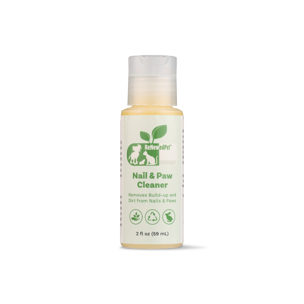 Nail & Paw Cleaner bottle with green “Nail & Paw Cleaner” label and yellow liquid