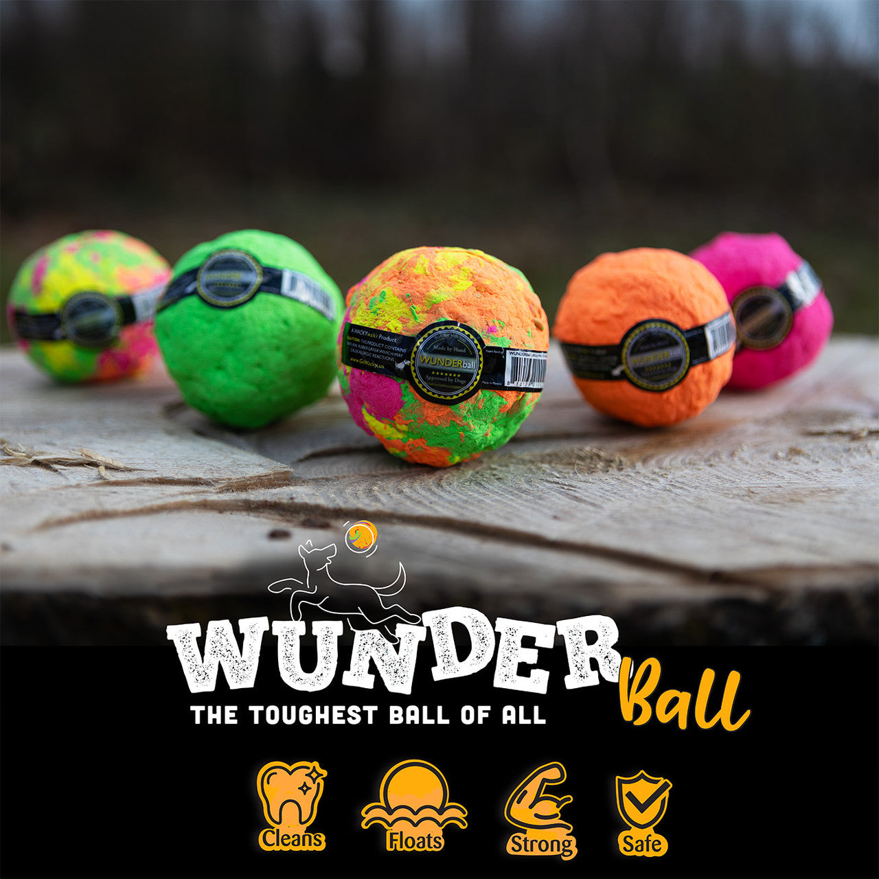 Assorted WUNDERball fetch balls in multiple colors, lined up on a surface